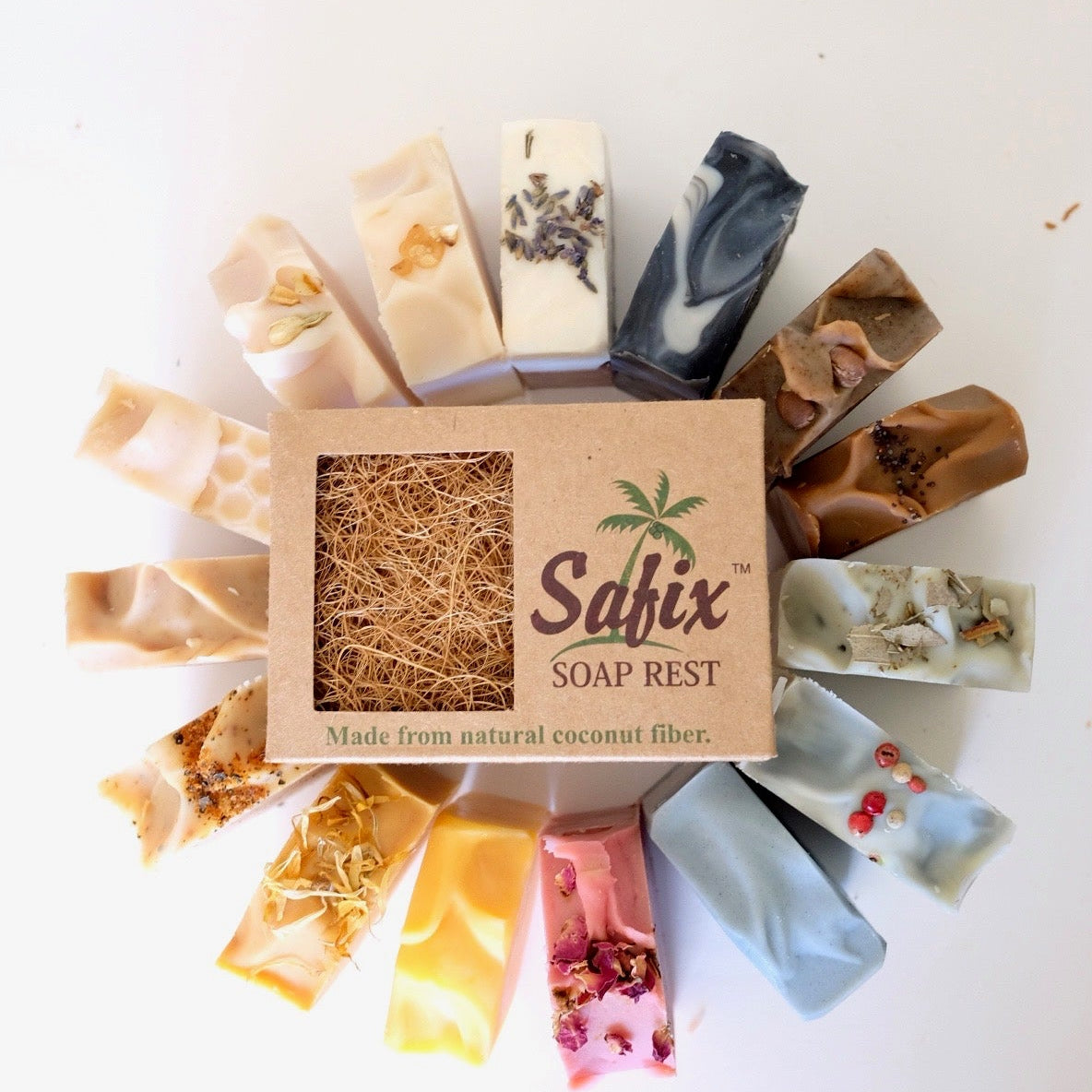 various coloured and scented tallow soap surrounding an eco coconut soap rest