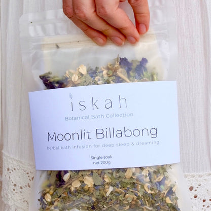 Packaged herbal mix labeled 'Moonlit Billabong' by 'iskah' on a white lace background.